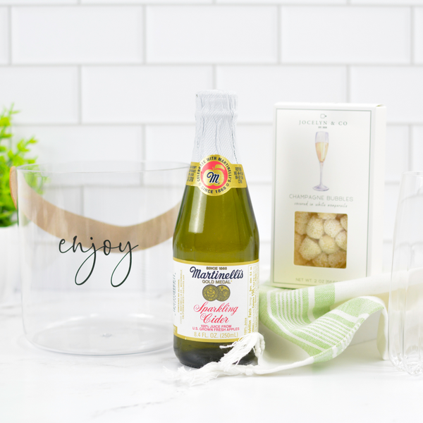 Jocelyn & Co. Pop, Pour & Celebrate gift set with sparkling cider, chocolates, and festive snacks