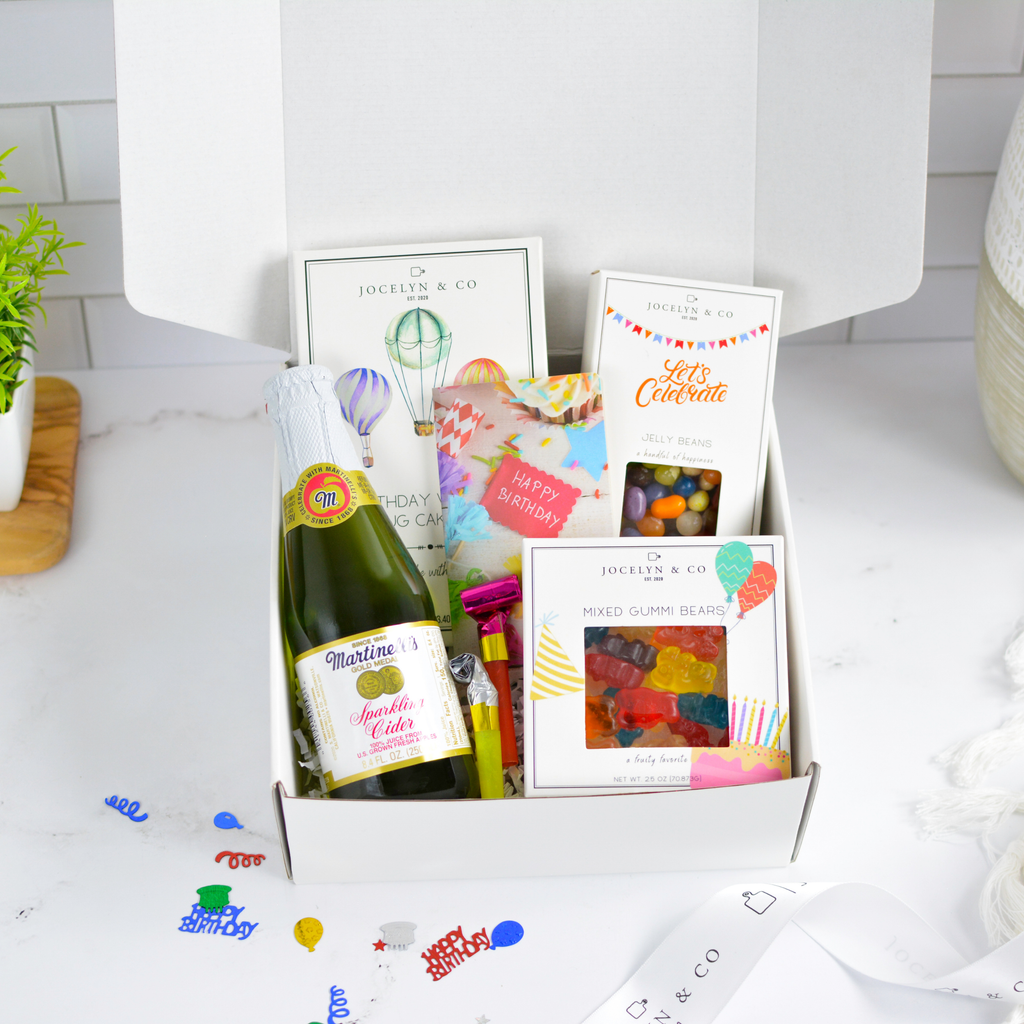 Jocelyn & Co. Happiest of Birthdays gift box with birthday mug cake, candy, and festive items in luxe packaging