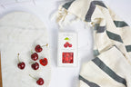 Jocelyn & Co. Cherry Sours candy in bright red signature packaging