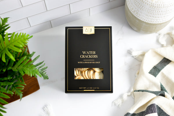 Jocelyn & Co. Black & Gold Water Crackers in premium black and gold luxury packaging