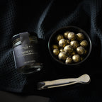 Open box of Jocelyn & Co. Prosecco Cordials showing chocolate-covered cordials