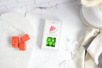 Jocelyn & Co. Watermelon Sours candy in bright signature packaging on marble surface